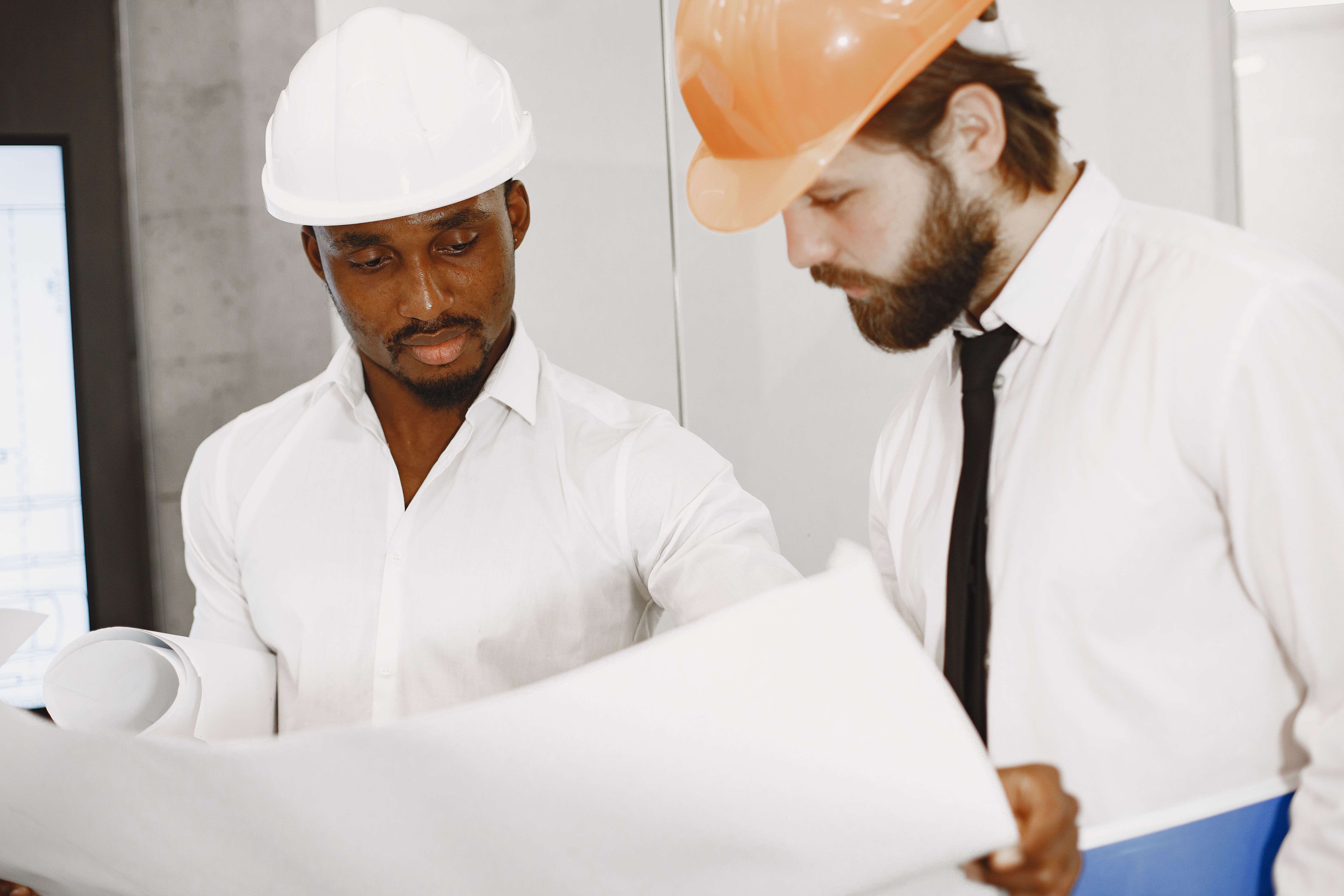 Engineer reviewing detailed construction plans